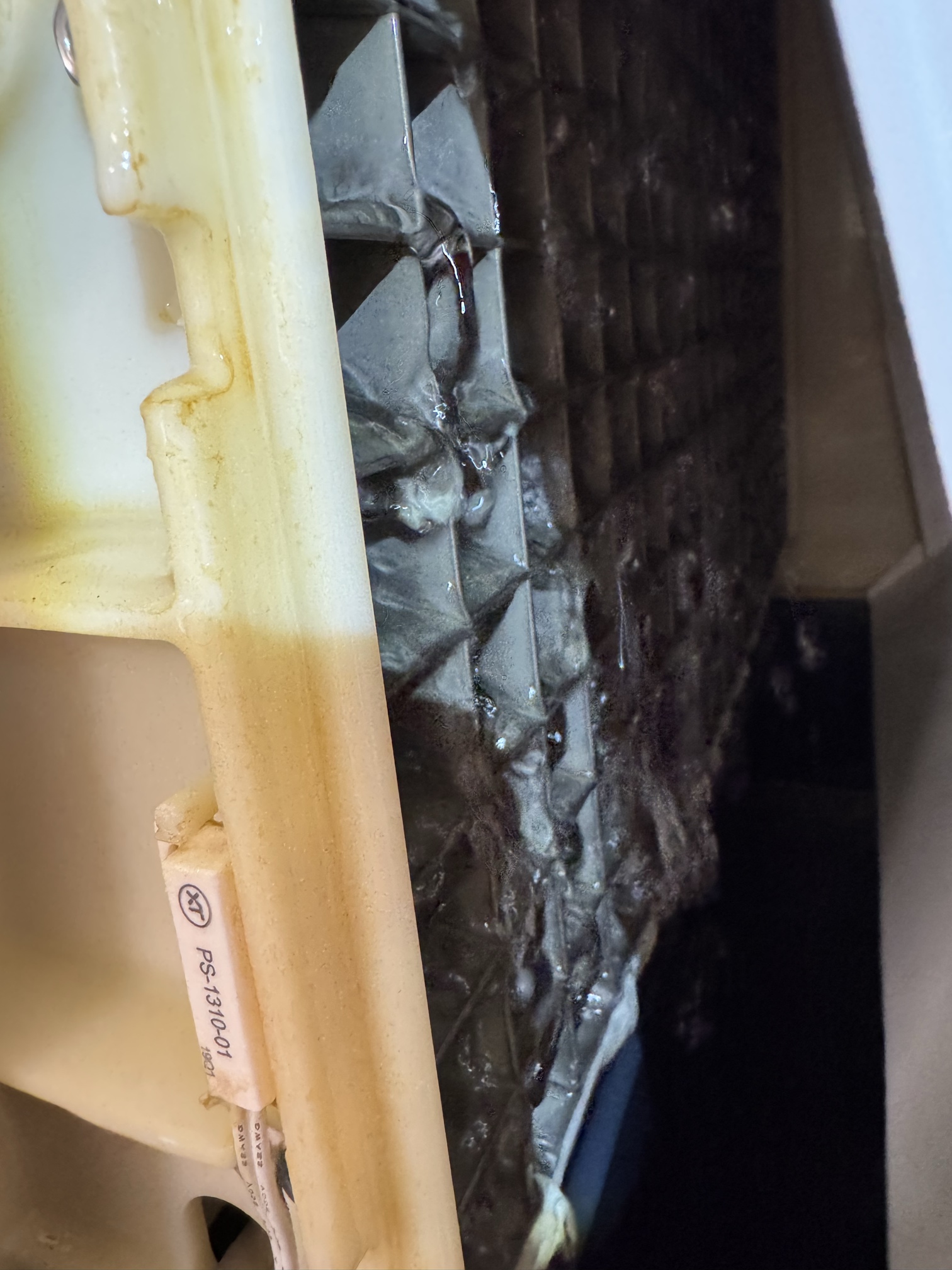 Scotsman evaporator plate with scale and slime on the water curtain where ice forms