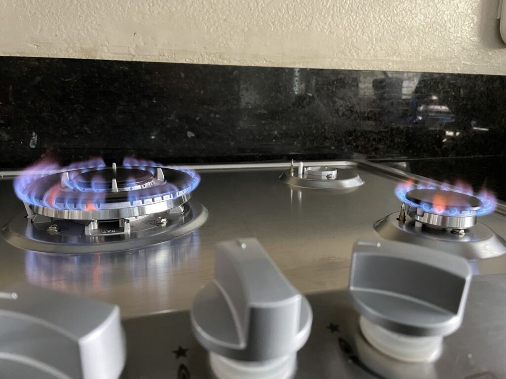 Gas cooktop burners lit after repair