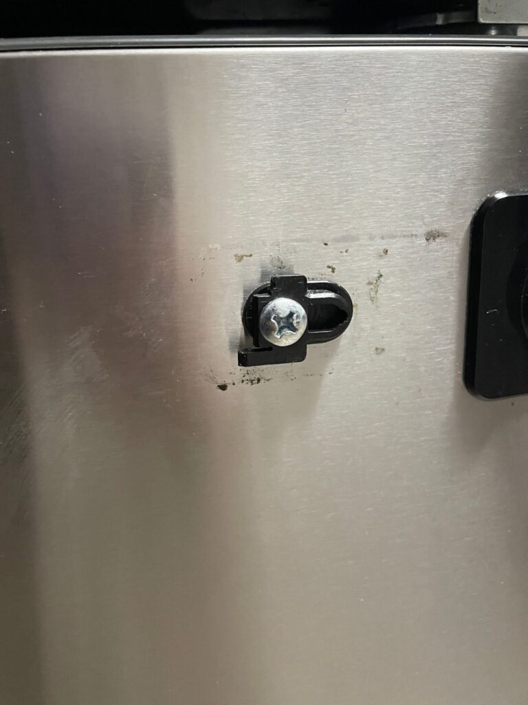 Cracked freezer handle mounting stud on a GE French door refrigerator