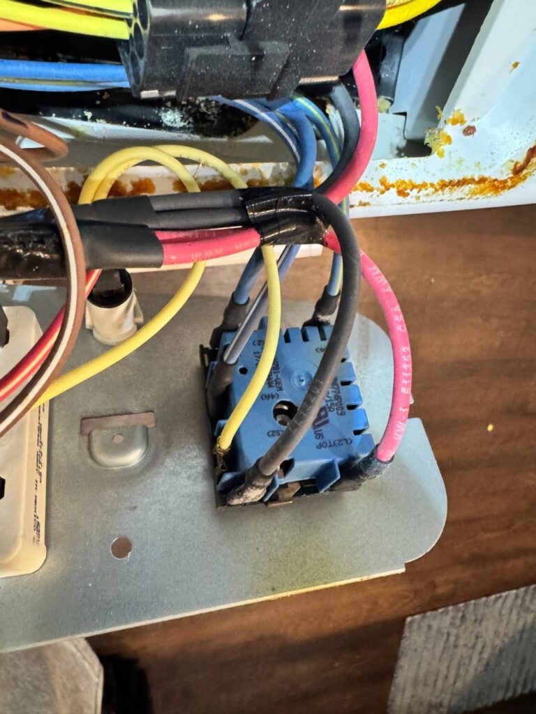Burner control switch wiring inside a GE electric range