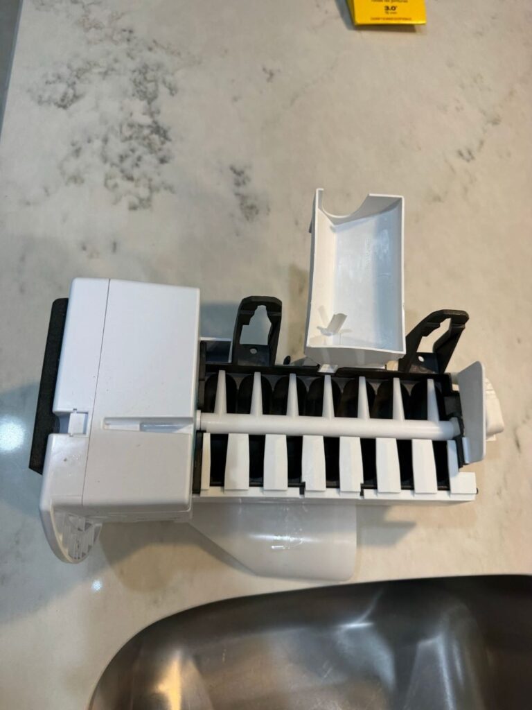 Ice maker assembly removed from a side-by-side freezer