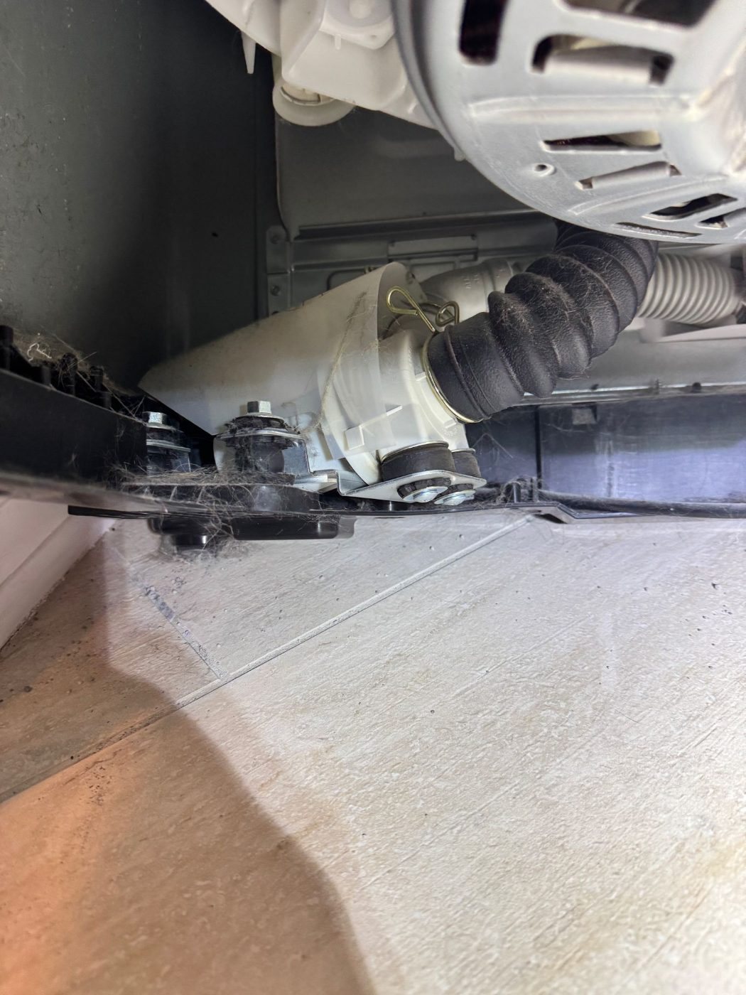 Drain pump and hose under an LG top load washer