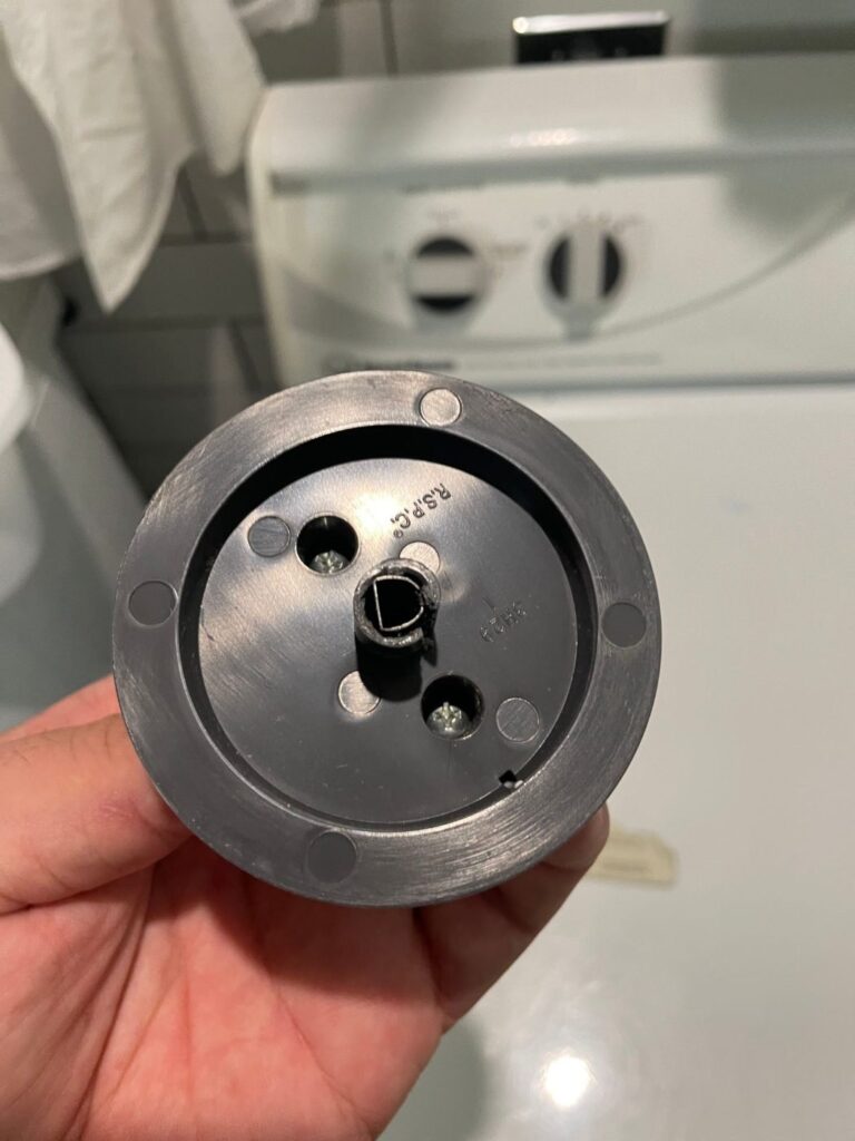 Worn timer knob assembly from a Speed Queen dryer